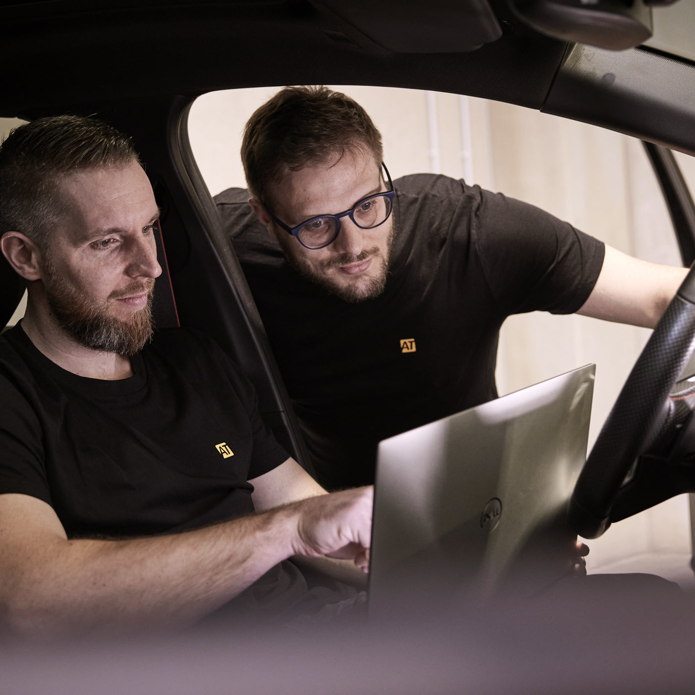 AutoTuner guys working inside the car